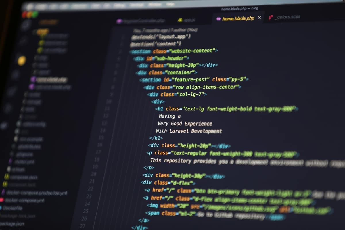 HTML and Blade code on a dark editor screen