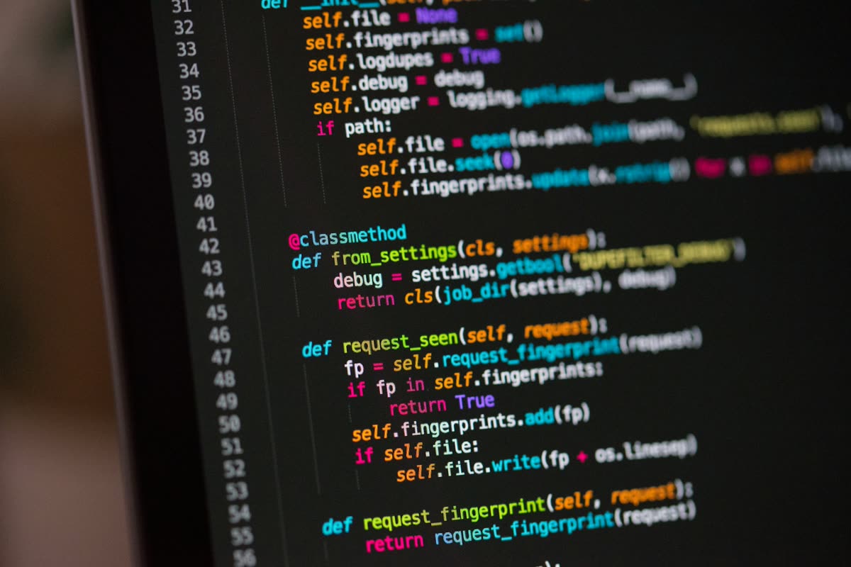 Source code on a monitor in a dark code editor